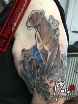 Realistic lioness tattoo, cubs, sea, storm. Jerry Magni tattoo artist. Italy