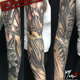 third sitting Full color biomech tattoo sleeve. Light blue metal parts as a shield for a sort of spine running inside the arm and a sort of bone structure over the forearm. Masterfully done by by the best tattoo artist Jerry Magni, Bergamo, Milan, Lugano, Italy.