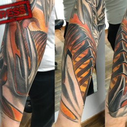 fourth sitting Full color biomech tattoo sleeve. Light blue metal parts as a shield for a sort of spine running inside the arm and a sort of bone structure over the forearm. Masterfully done by by the best tattoo artist Jerry Magni, Bergamo, Milan, Lugano, Italy.