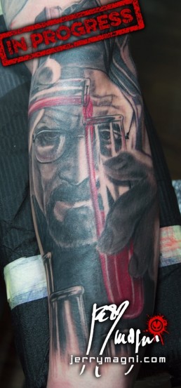Fifth sitting Black and grey full sleeve tattoo. On the shoulder a beautiful portrait of a blindfolded girl, a red tear on her face, inside the arm a skull with a clock nestled in the cranium. On the forearm mister Heisenberg, from the tv series Breaking Bad, is working with tubes full of red liquid. Inside the forearm a mister hide with bloodshot eyes is roaming in ancient London alleys. Immaculately done by the best artist Jerry Magni, Italy, Milan, Bergamo, Lugano.