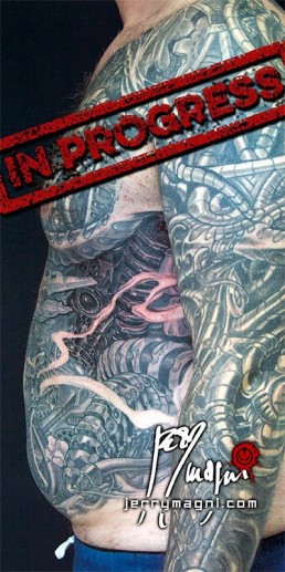 Thirtysecond sitting Biomech and oriental tattoo jacket, metal parts, cherry flowers and waves all over the sleeves, back and torso. Jerry Magni Tattoo Artist Bergamo, Milan, Italy