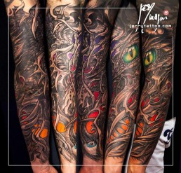 fourth sitting Biomech bio organic full sleeve and part of the neck tattoo. Abstract shapes with scales and stings in which there are a human blue eye and a snake eye. The background is done with orange, purple and red color. Done by by the best tattoo artist Jerry Magni, Bergamo, Milan, Lugano, Italy.