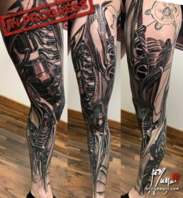 7th sitting of a coloured biomech tattoo leg sleeve