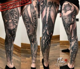 8th sitting of a coloured biomech tattoo leg sleeve