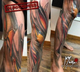 sixth sitting Full color biomech leg sleeve tattoo. Blue metallic surfaces with warm lights inside. Masterfully done by Jerry Magni Tattoo artist, one of the best Italian tattoo artist; Milano, Bergamo, Lugano, Italy Lombardy.