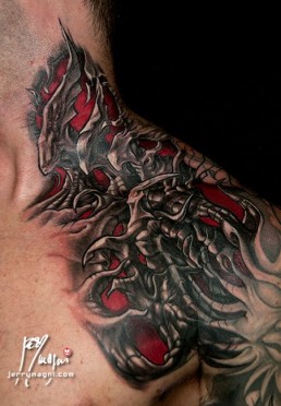 sixth sitting Biomech bio organic full sleeve and part of the neck tattoo. Abstract shapes with scales and stings in which there are a human blue eye and a snake eye. The background is done with orange, purple and red color. Done by by the best tattoo artist Jerry Magni, Bergamo, Milan, Lugano, Italy.