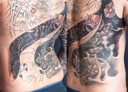 Twentieth sitting Black and grey biomech tattoo mixed with oriental elements, cherry flowers and waves, on a back and two full sleeves. Jerry Magni Tattoo Artist Milano. Bergamo, Lugano.