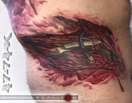 Side View of a Biomech Tear tattooed on a back. Masterful work from one of the best tattoo artist: Jerry Magni.