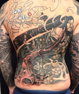 Twentifirst sitting Black and grey biomech tattoo mixed with oriental elements, cherry flowers and waves, on a back and two full sleeves. Jerry Magni Tattoo Artist Milano. Bergamo, Lugano.