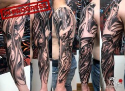 Second sitting of a colour biomech tattoo sleeve