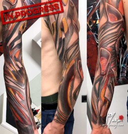 sixth sitting of a colour biomech tattoo sleeve