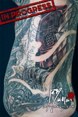 Thirtyfirst sitting Biomech and oriental tattoo jacket, metal parts, cherry flowers and waves all over the sleeves, back and torso. Jerry Magni Tattoo Artist Bergamo, Milan, Italy
