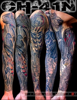 black and grey biomech tattoo sleeve with integration of an old script on the inner forearm. Done by Jerry Magni, the best Italian tattoo artist in biomechanical style