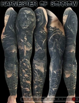 Black and grey tattoo sleeve. A cross over a pile of skull, by side the grim reaper. Everything under a leaden sky