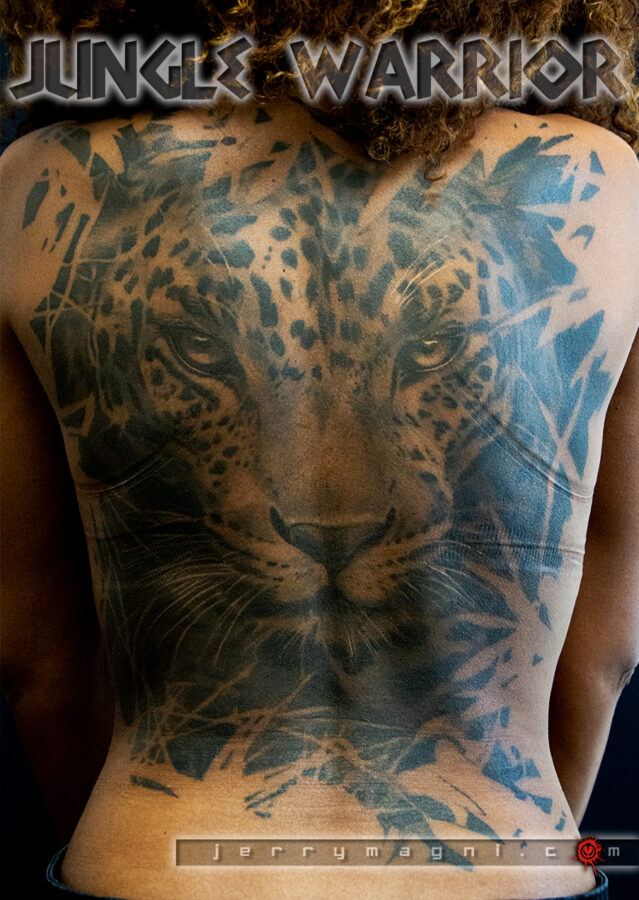 Black and grey leopard tattoo on black skin. Masterfully done by Jerry Magni, one of the best Italian tattoo artist