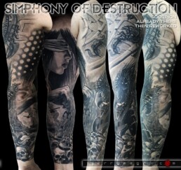 Tatuaggio in bianco e nero a tutta manica. Una landa di teschi, tra cui un teschio di leone e di ariete, su di cui si erge una maestosa e scura figura che suona il basso mentre fa headbanging. Sullo sfondo uno scenario di guerra con fumo carri armati ed elicotteri. All'interno del braccio la dea della giustizia tiene tra le dita un bilancino. Sulla spalla uno scorpione si muove su una roccia scolpita con simboli zodiacali. eseguito dal miglior tatuatore italiano, Jerry magni, Lombardia, Bergamo, Milano, Lecco, Como, Varese, Crema, Mantova.