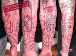 first sitting biomech black and grey tattoo