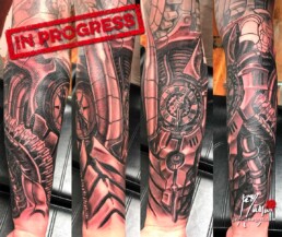 second sitting biomech black and grey tattoo