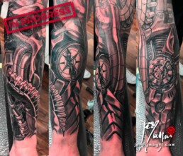 third sitting biomech black and grey tattoo
