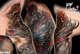 seventh sitting Biomech bio organic full sleeve and part of the neck tattoo. Abstract shapes with scales and stings in which there are a human blue eye and a snake eye. The background is done with orange, purple and red color. Done by by the best tattoo artist Jerry Magni, Bergamo, Milan, Lugano, Italy.