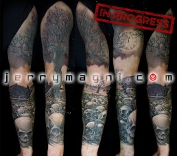Sixth sitting Black and grey full sleeve tattoo. A graveyard covered with skull from which rises a majestic olive tree. in the foreground there are a few tombstone. the artwork is completed by clouds at the horizon, above them a full moon on which there are clock arms pointing five minutes to midnight. Outstanding piece of art, masterfully done by by the best tattoo artist Jerry Magni, Bergamo, Milan, Lugano, Italy.