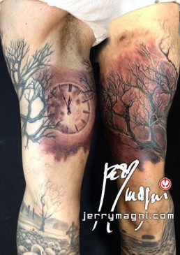 Fifth sitting Black and grey full sleeve tattoo. A graveyard covered with skull from which rises a majestic olive tree. in the foreground there are a few tombstone. the artwork is completed by clouds at the horizon, above them a full moon on which there are clock arms pointing five minutes to midnight. Outstanding piece of art, masterfully done by by the best tattoo artist Jerry Magni, Bergamo, Milan, Lugano, Italy.