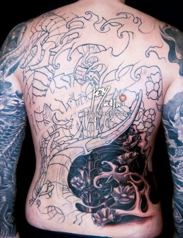 Nineteenth sitting Black and grey biomech tattoo mixed with oriental elements, cherry flowers and waves, on a back and two full sleeves. Jerry Magni Tattoo Artist Milano. Bergamo, Lugano.
