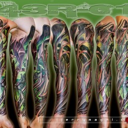 Full color biomech sleeve tattoo. brown, green and white colors. Alien metal parts intersects on the arm with green lights coming from the inside. Masterfully done by by the best tattoo artist Jerry Magni, Bergamo, Milan, Lugano, Italy.