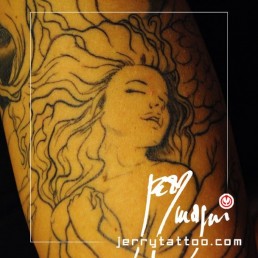 Detail first sitting Full color tattoo sleeve with a blue dragon wrapped around the arm, keeping a beautiful naked girl inside its spire. Artwork masterfully done by the best tattoo artist Jerry Magni, Bergamo, Milan, Lugano, Italy.